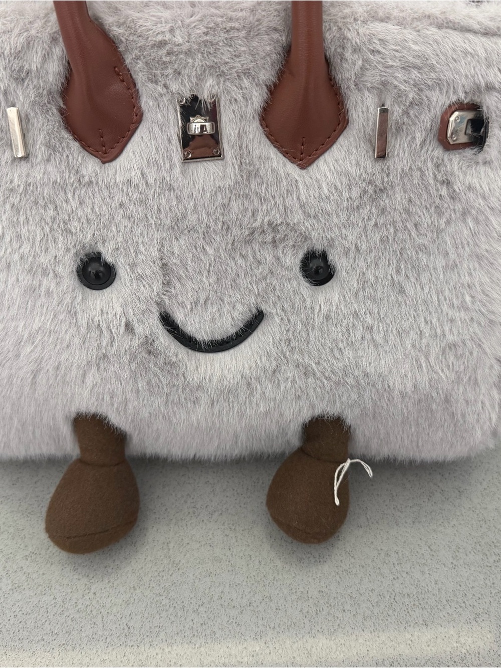 Plush Gray Smiley Handbag with Brown Accents
